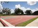 Outdoor basketball court ready for a game, surrounded by well-maintained landscaping at 13503 22Nd E Ct, Parrish, FL 34219