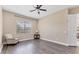 Bedroom featuring wood flooring, a ceiling fan, and a large window at 13503 22Nd E Ct, Parrish, FL 34219