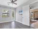 Bedroom features hardwood floors and access to lanai and pool at 13503 22Nd E Ct, Parrish, FL 34219