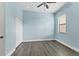 Bright bedroom with wood floors, ample closet space, and a large window at 13503 22Nd E Ct, Parrish, FL 34219