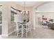 Bright breakfast nook with a view to the backyard, tile flooring, and stylish lighting at 13503 22Nd E Ct, Parrish, FL 34219