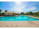 Beautiful community pool featuring clear blue water, sun loungers, and a clubhouse at 13503 22Nd E Ct, Parrish, FL 34219