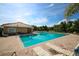 Inviting community pool with sun loungers, lush landscaping, and a well-maintained deck at 13503 22Nd E Ct, Parrish, FL 34219