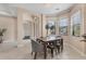 Bright dining room with large windows, stylish lighting, and an open layout at 13503 22Nd E Ct, Parrish, FL 34219