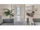 Elegant foyer with tiled flooring and decorative glass front door, leading to a formal dining area at 13503 22Nd E Ct, Parrish, FL 34219