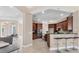 Well-equipped kitchen with dark wood cabinetry, breakfast bar, and modern appliances at 13503 22Nd E Ct, Parrish, FL 34219