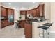 Gourmet kitchen featuring stainless steel appliances, granite countertops, and stylish mosaic backsplash at 13503 22Nd E Ct, Parrish, FL 34219