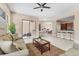 Open-concept living area with tile floors connecting living room, dining area, and kitchen at 13503 22Nd E Ct, Parrish, FL 34219