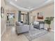 This spacious living room features neutral tones, tile floors and elegant furniture at 13503 22Nd E Ct, Parrish, FL 34219