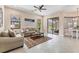 Cozy living room with neutral décor, tile flooring, and views of the outdoors at 13503 22Nd E Ct, Parrish, FL 34219