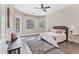 Cozy main bedroom with a soft rug, plush bedding, and natural light from multiple windows at 13503 22Nd E Ct, Parrish, FL 34219