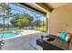 Enjoy a screened-in pool area with a view of the lake, perfect for relaxation and entertaining at 13503 22Nd E Ct, Parrish, FL 34219