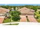 Aerial view of the property with a manicured lawn and a tile roof at 1375 Backspin Dr, Englewood, FL 34223