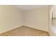 Empty, bright bedroom with neutral carpet, beige walls, and a window with blinds at 1375 Backspin Dr, Englewood, FL 34223