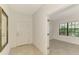 Entryway with tile flooring and an open doorway to another room with a window at 1375 Backspin Dr, Englewood, FL 34223