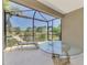 Enjoy the spacious screened-in patio with lake views at 1375 Backspin Dr, Englewood, FL 34223