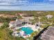 Community pool and outdoor seating at 1375 Backspin Dr, Englewood, FL 34223