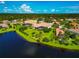 Aerial view of the property showcasing the expansive lawn and water view at 14714 5Th Ne Ter, Bradenton, FL 34212