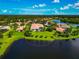 Beautiful home with lush landscaping, screened-in pool, and stunning lake views in a desirable community at 14714 5Th Ne Ter, Bradenton, FL 34212