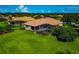 Expansive backyard featuring a screened lanai with a pool and well-maintained landscaping for outdoor enjoyment at 14714 5Th Ne Ter, Bradenton, FL 34212