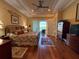 Spacious bedroom with tray ceilings, wood floors, and access to the outdoor patio at 14714 5Th Ne Ter, Bradenton, FL 34212