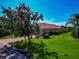 Lovely home featuring well-maintained landscaping and mature trees providing ample shade and curb appeal at 14714 5Th Ne Ter, Bradenton, FL 34212