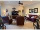 Spacious living room featuring leather seating, tile floors, and tasteful decorations at 14714 5Th Ne Ter, Bradenton, FL 34212