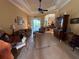 Inviting living room featuring a coffered ceiling, tile floors, and sliding glass doors leading to an outdoor area at 14714 5Th Ne Ter, Bradenton, FL 34212