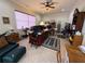 Home office with a large desk, custom cabinetry, and a comfortable seating area at 14714 5Th Ne Ter, Bradenton, FL 34212