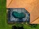 Top-down shot of screened pool with green water and landscaped yard at 14714 5Th Ne Ter, Bradenton, FL 34212