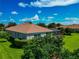 Aerial view of home with manicured lawn and pool with screened enclosure at 14714 5Th Ne Ter, Bradenton, FL 34212