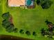 Birds-eye view of vast green grass yard with meticulously arranged plant beds at 14714 5Th Ne Ter, Bradenton, FL 34212