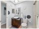 Modern bathroom with designer lights, unique sink vanity, and glass shower door at 1500 Sunset Rd # B4, Tarpon Springs, FL 34689