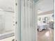 View from the doorway to the bathroom, looking into the bright bedroom at 1500 Sunset Rd # B4, Tarpon Springs, FL 34689