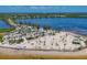 Scenic view of a sandy beach with palm trees and parking area at 1500 Sunset Rd # B4, Tarpon Springs, FL 34689