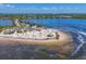 Scenic aerial shot of a sandy beach with blue waters and recreational activities at 1500 Sunset Rd # B4, Tarpon Springs, FL 34689