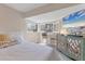 Comfortable bedroom with natural light, TV, and modern decor at 1500 Sunset Rd # B4, Tarpon Springs, FL 34689