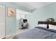Bedroom with a desk, closet, and bright lighting makes for an efficient space at 1500 Sunset Rd # B4, Tarpon Springs, FL 34689