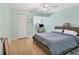 Bright bedroom with a closet, desk, and wooden floors for comfortable living at 1500 Sunset Rd # B4, Tarpon Springs, FL 34689