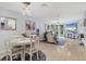 The dining room table and chairs offer a comfortable place to gather and enjoy meals at 1500 Sunset Rd # B4, Tarpon Springs, FL 34689