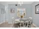 Cozy dining area with a round table, seating for four, and stylish lighting fixture at 1500 Sunset Rd # B4, Tarpon Springs, FL 34689