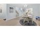 Dining room featuring dining table and chairs and views to other rooms at 1500 Sunset Rd # B4, Tarpon Springs, FL 34689