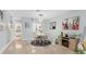 Open-concept dining room features a round table and is adjacent to the living area at 1500 Sunset Rd # B4, Tarpon Springs, FL 34689