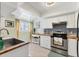 Bright kitchen with stainless steel appliances, wooden countertops, and a skylight for natural light at 1500 Sunset Rd # B4, Tarpon Springs, FL 34689