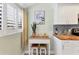 The kitchen area includes a breakfast nook with seating and a sunny window view at 1500 Sunset Rd # B4, Tarpon Springs, FL 34689