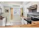 Bright kitchen featuring butcher block countertops, stainless appliances, and a sunny skylight at 1500 Sunset Rd # B4, Tarpon Springs, FL 34689