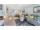 Bright living room with modern furniture, neutral paint, and hardwood floors at 1500 Sunset Rd # B4, Tarpon Springs, FL 34689