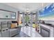 Cozy living room area featuring a corner nook and ocean view at 1500 Sunset Rd # B4, Tarpon Springs, FL 34689