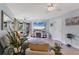 Living room with modern decor, ceiling fans and plenty of natural light at 1500 Sunset Rd # B4, Tarpon Springs, FL 34689