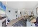Spacious living room with a fireplace and views into the dining room at 1500 Sunset Rd # B4, Tarpon Springs, FL 34689